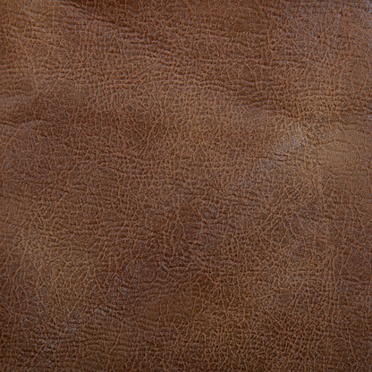 Close-up of the brown textured leather on the Golden Tech PR527 Cloud Recliner With Lift Assist & Twilight - SM/MD, showing fine natural creases, wrinkles, and grain patterns with a slightly worn matte finish and subtle highlights.
