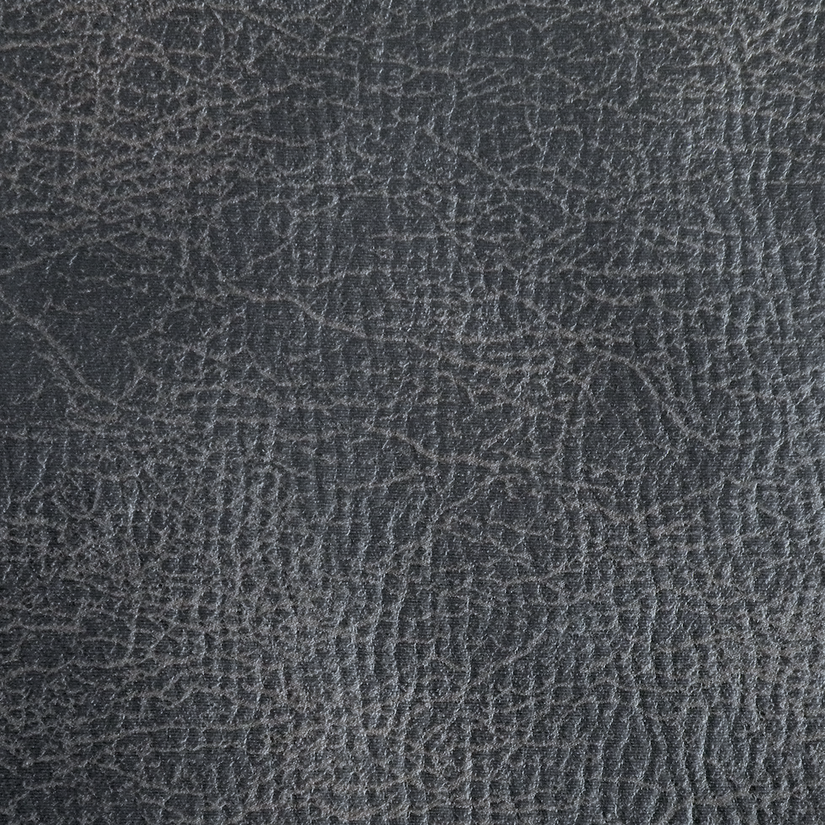 Close-up of the dark gray textured upholstery on the Golden Tech PR527 Cloud Recliner With Lift Assist & Twilight - SM/MD, featuring a leather-like pattern with fine intersecting lines and a subtly shiny finish.