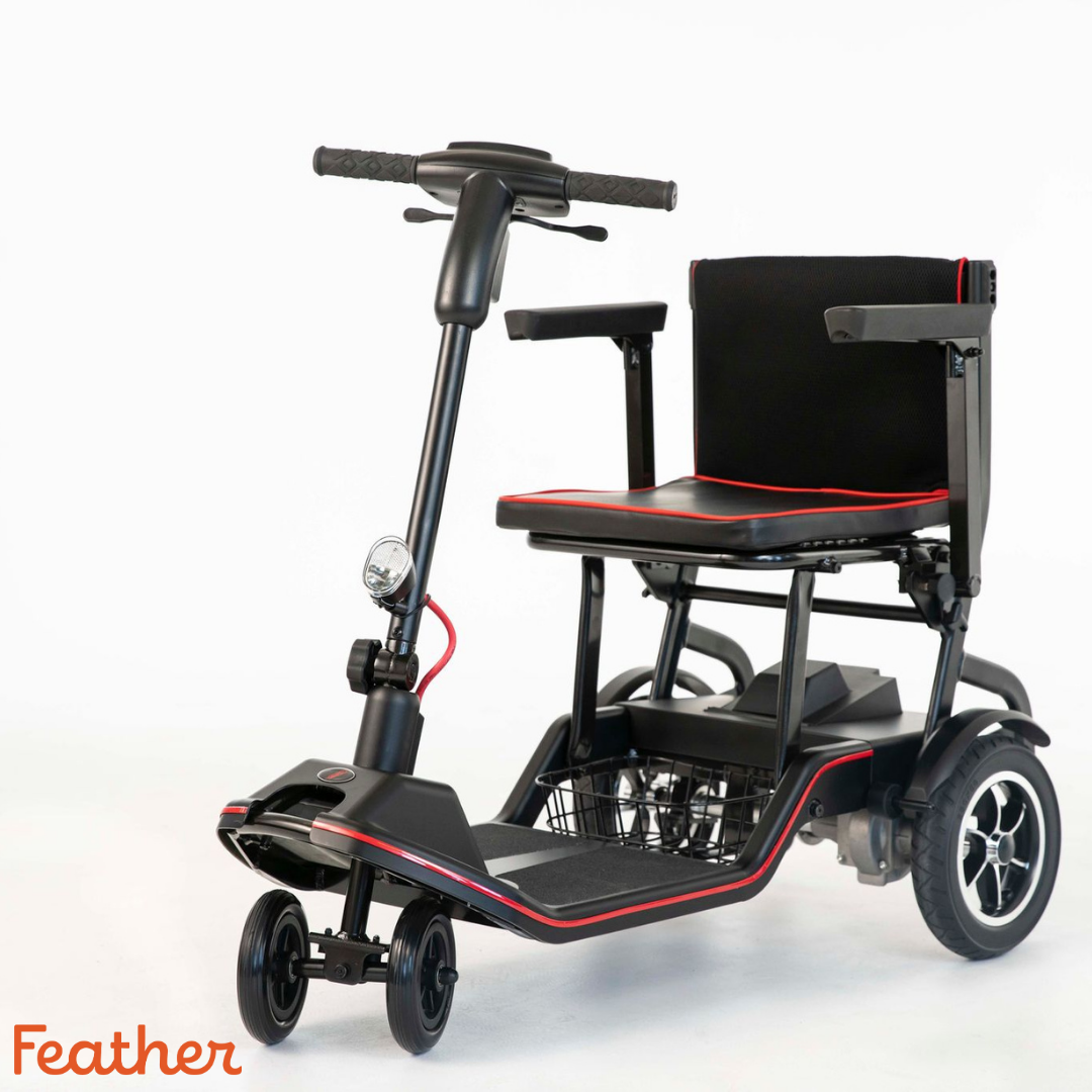 The Feather Ultralite Portable Scooter – Only 37 lbs is a black, lightweight folding scooter with red accents, armrests, a basket under the seat, and three wheels. The orange Feather logo appears in the lower left on a white background.