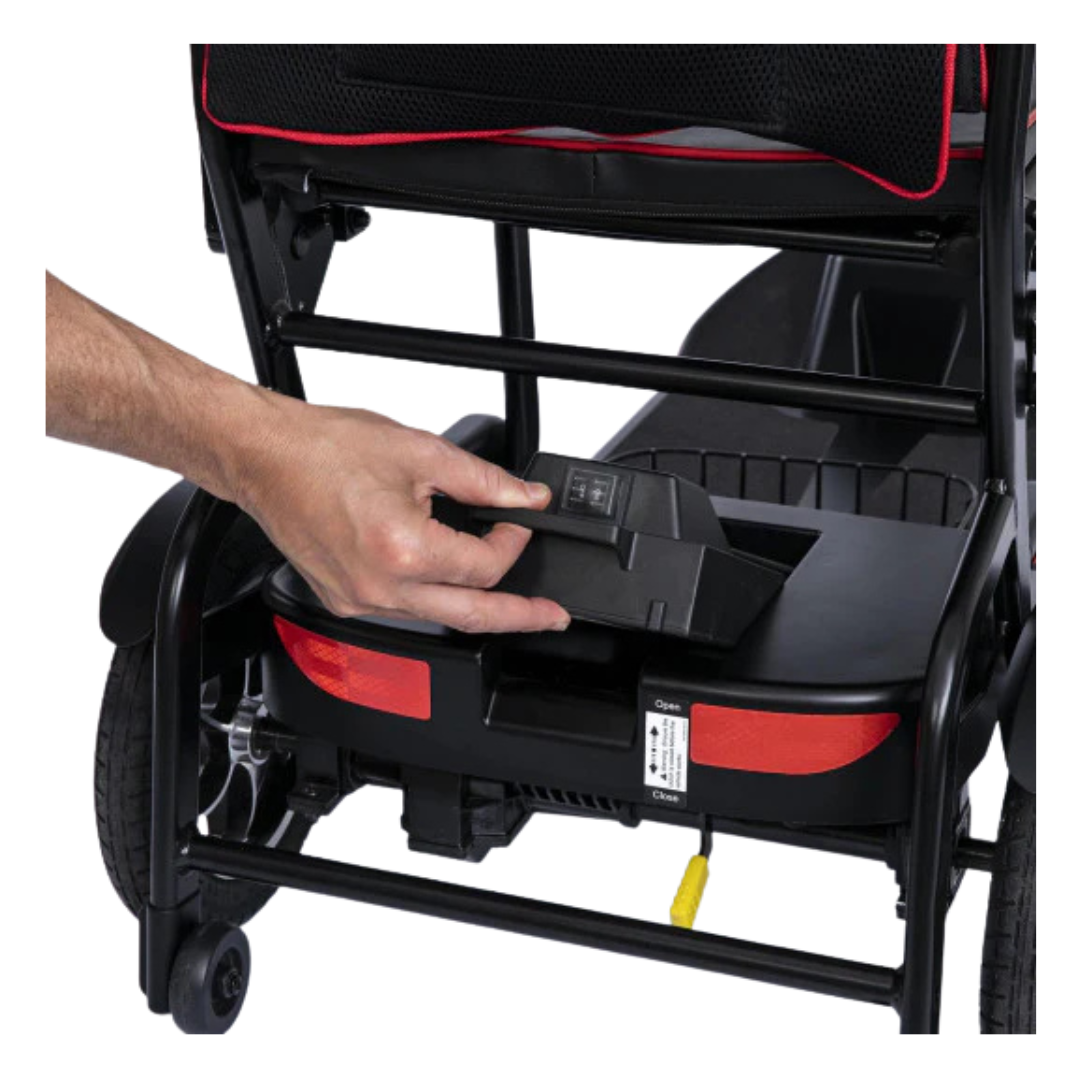 A hand inserts or removes a battery pack from the rear compartment of the black and red Feather Ultralite Portable Scooter—only 37 lbs—for lightweight, compact travel mobility.