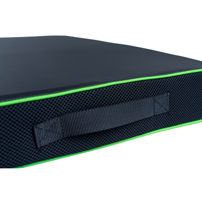 Close-up of the Feather Portable Cushions – All Purpose Cushion in black, with a textured side, sewn-in handle, and bright green piping for easy transport.