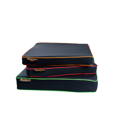 Three Feather Portable Cushions with black, water-resistant surfaces, colorful piping (orange, red, green), and handy handles are stacked together; each is labeled "feather" in the corner.