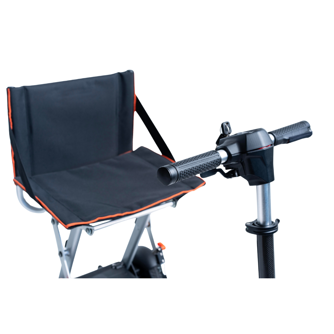 Close-up of the Feather 27X Folding Portable Mobility Scooter (only 27 lbs) featuring a black padded seat with orange trim and armrest, plus handlebar controls. The background is white.