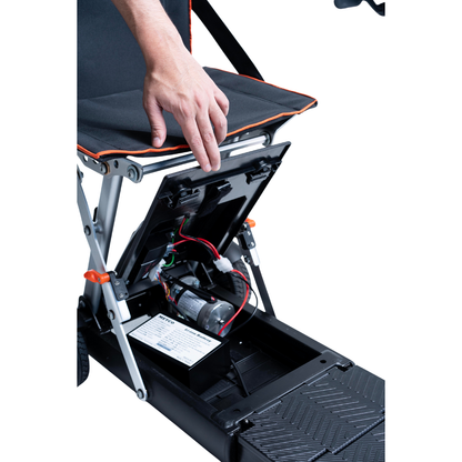 A person lifts a compartment under the Feather 27X Folding Portable Mobility Scooter's seat, revealing its internal wiring and motor.
