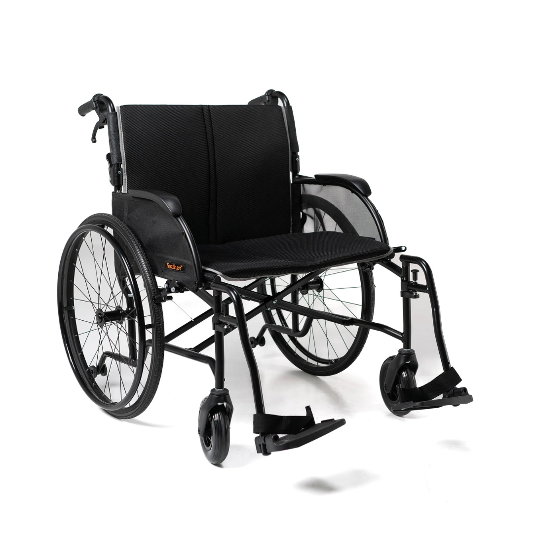 The Feather HD Ultralight Bariatric Wheelchair, weighing only 22 lbs, is shown in black with large rear wheels, smaller front casters, a padded seat and backrest, armrests, and footrests on a white background.