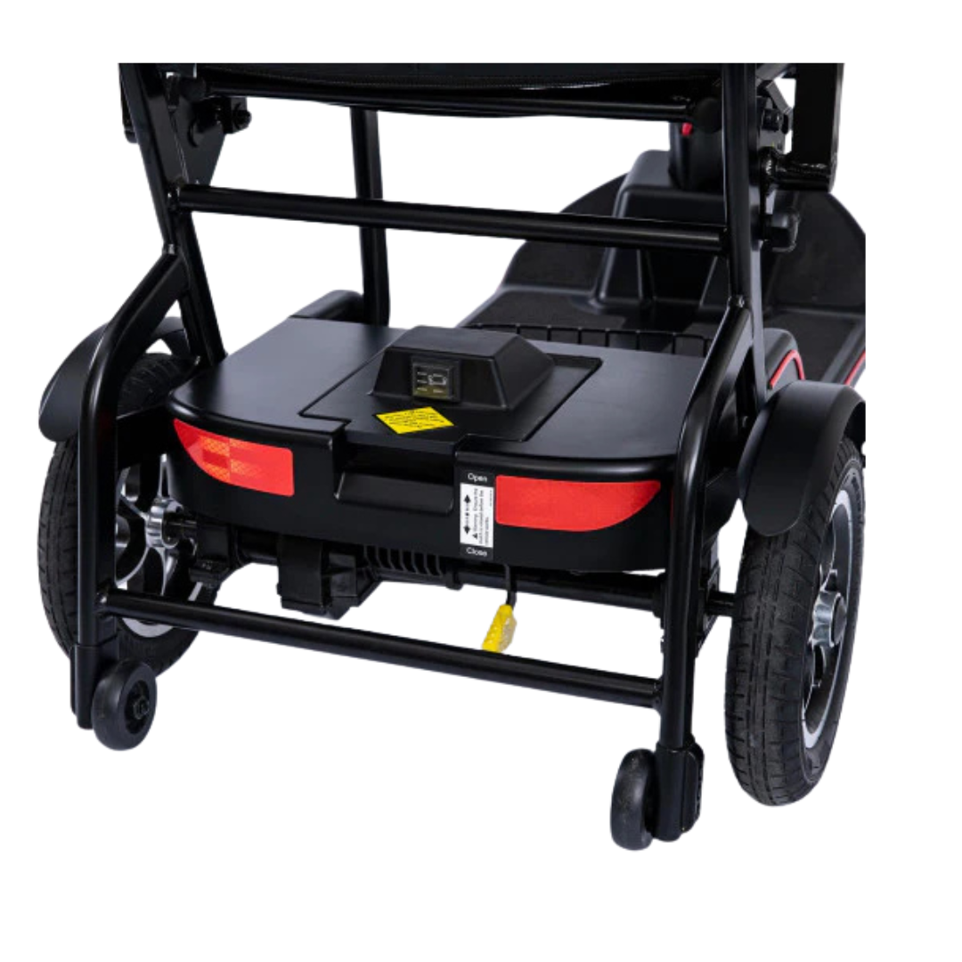 Rear view of a Feather Battery Replacement installed on a Feather Scooter, showing wheels, red reflectors, battery compartment, and a yellow charging cable plugged into the battery.