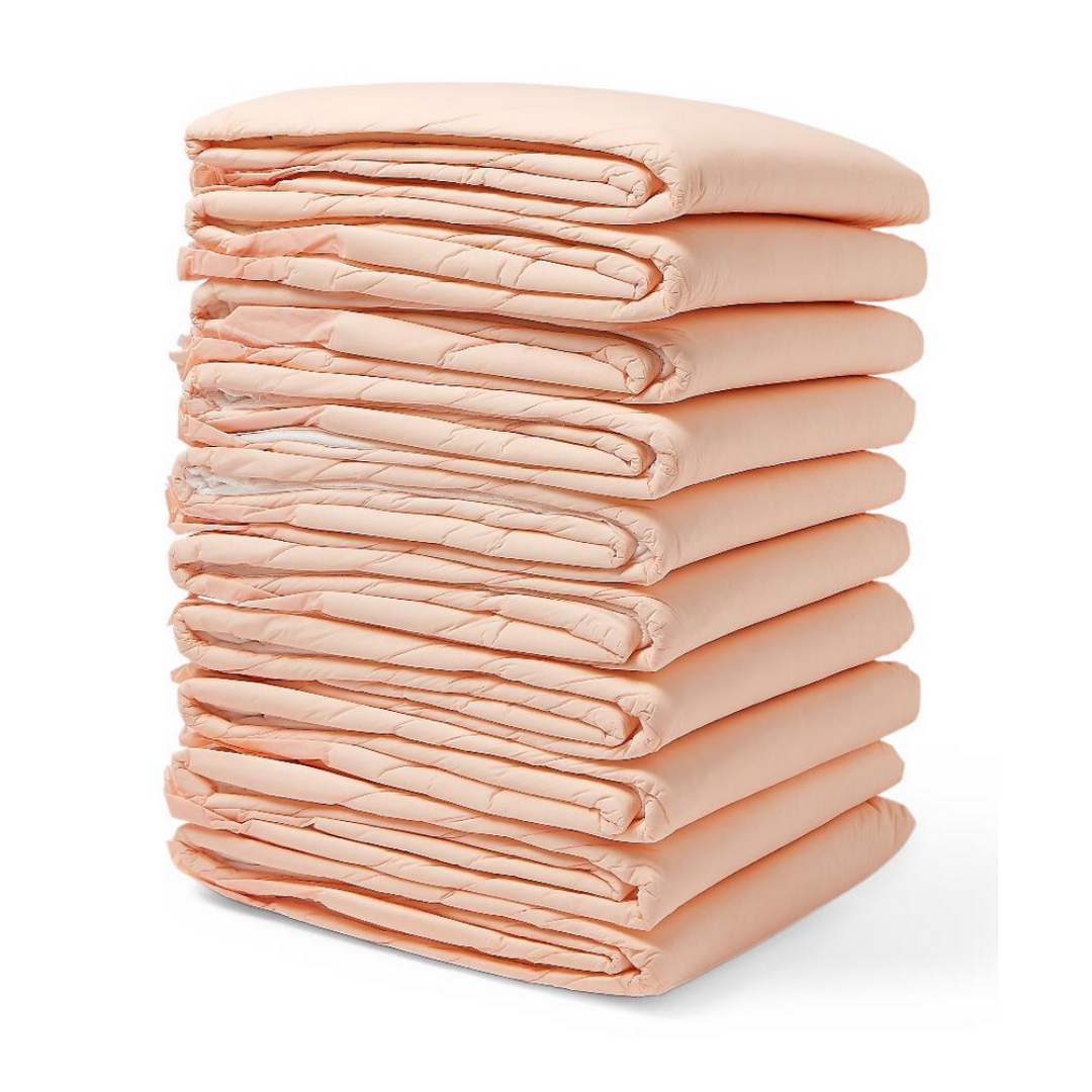 A neatly stacked pile of ten folded, peach Medline FitRight Underpads highlights incontinence products crafted for dependable absorbency and odor control on a crisp white background.