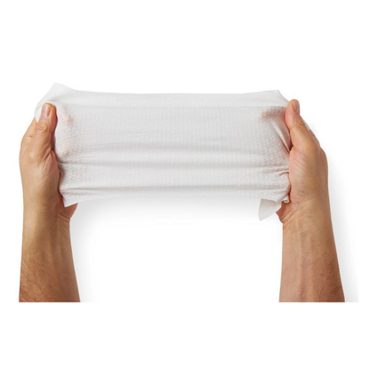 Two hands stretch a FitRight Aloe Quilted XL Personal Cleansing Wipe horizontally against a white background, showcasing the wipe’s flexibility and strength.