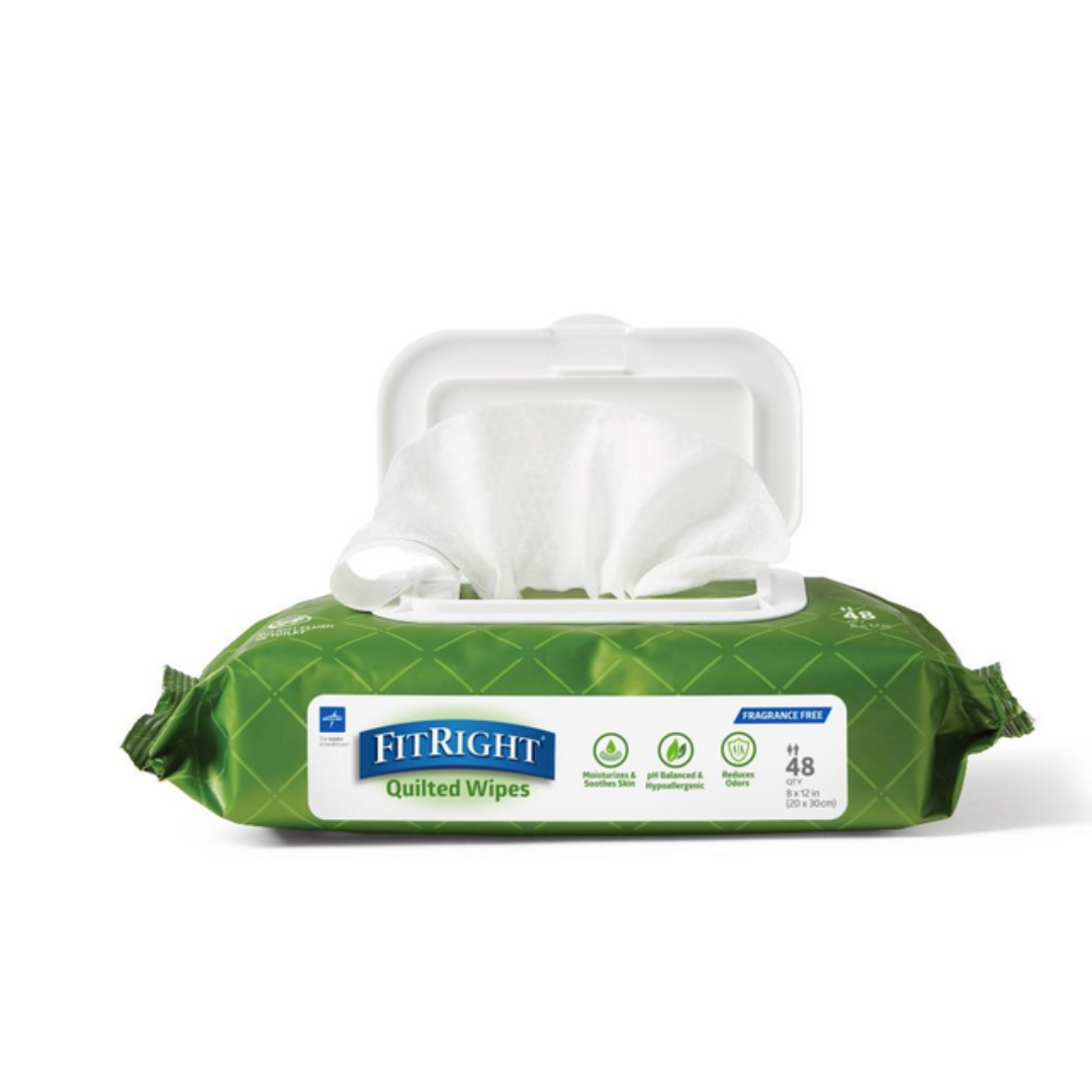 A green pack of FitRight Aloe Quilted XL Personal Cleansing Wipes with one wipe pulled through the open white lid, showing the label and icons for incontinence care and sensitive skin.