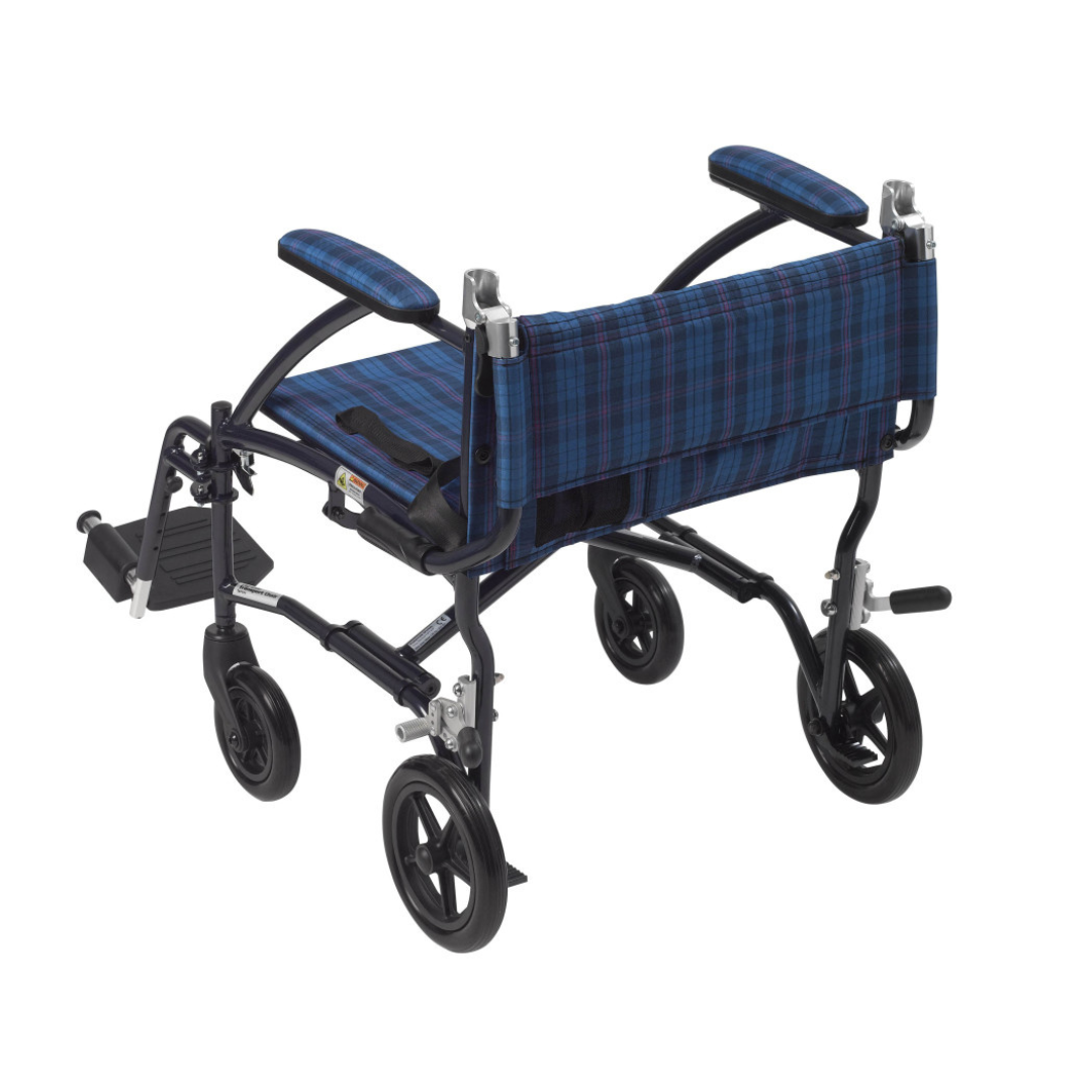 The Drive Fly-Lite Aluminum Transport Chair features a blue plaid seat and backrest, black armrests, footrests, and four small black wheels. This ultra-lightweight, portable chair folds easily, making it perfect for travel.