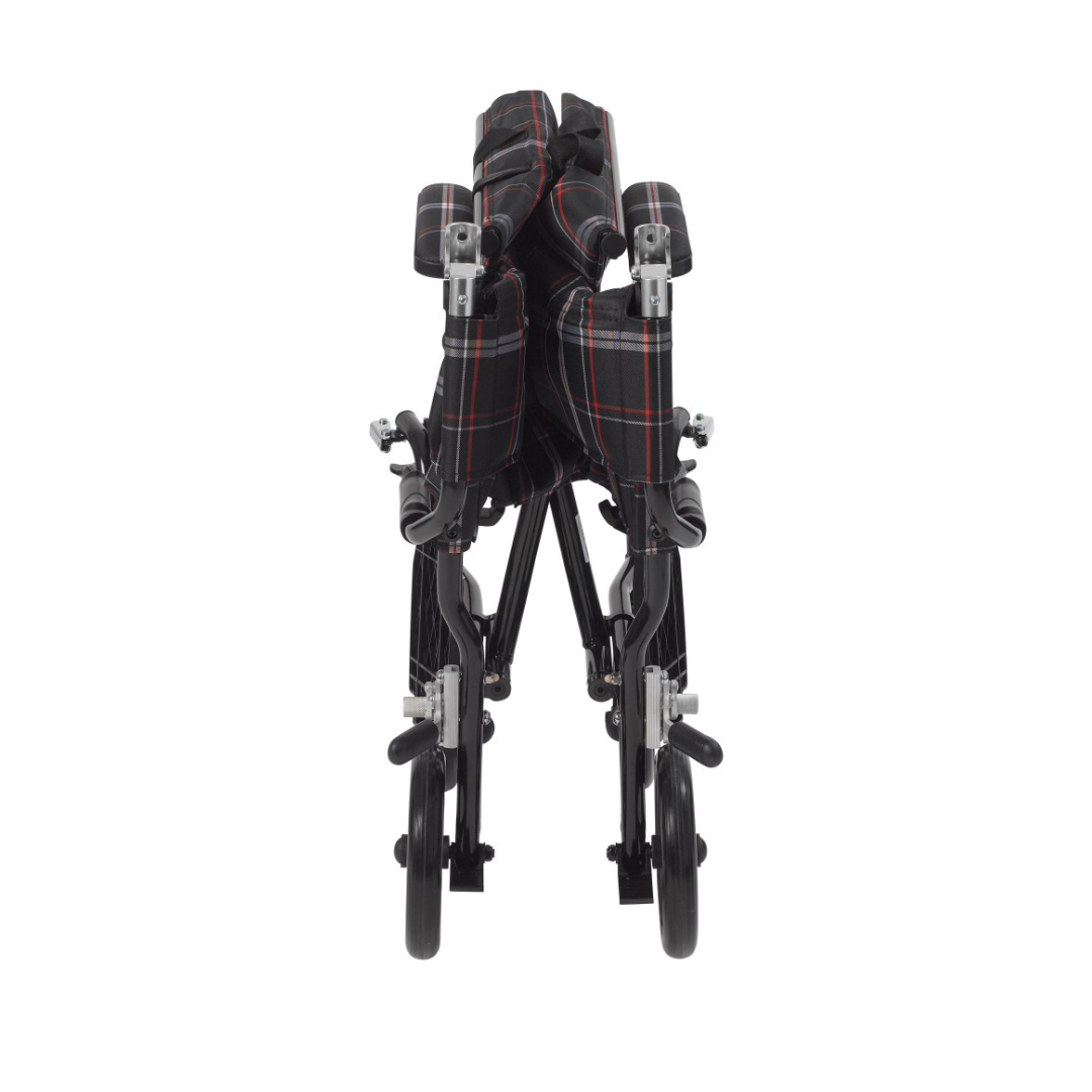 The Drive Fly-Lite Aluminum Transport Chair, seen from the front, features a folded black frame with a red and white plaid seat and backrest, highlighting its ultra-lightweight, compact, and portable design.