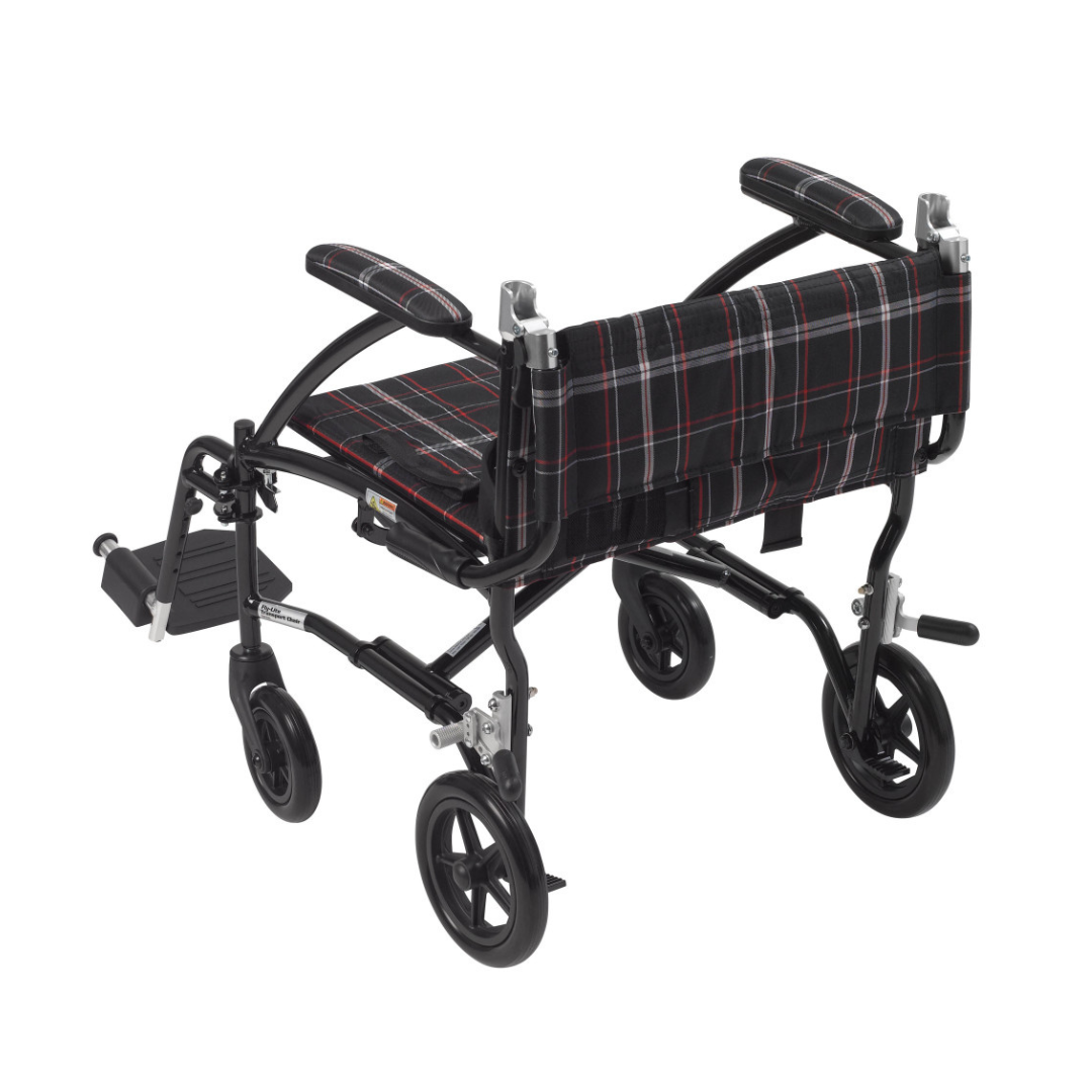 The Drive Fly-Lite Aluminum Transport Chair is a lightweight, black and red plaid folding wheelchair with small wheels, footrests, and padded armrests, shown from the back at an angle.