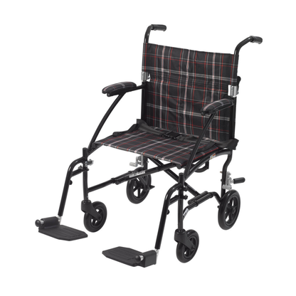 The Drive Fly-Lite Aluminum Transport Chair features a black frame, plaid fabric seat and backrest, armrests, four small wheels, and footrests—making it an ultra-lightweight, portable wheelchair ideal for travel and storage.