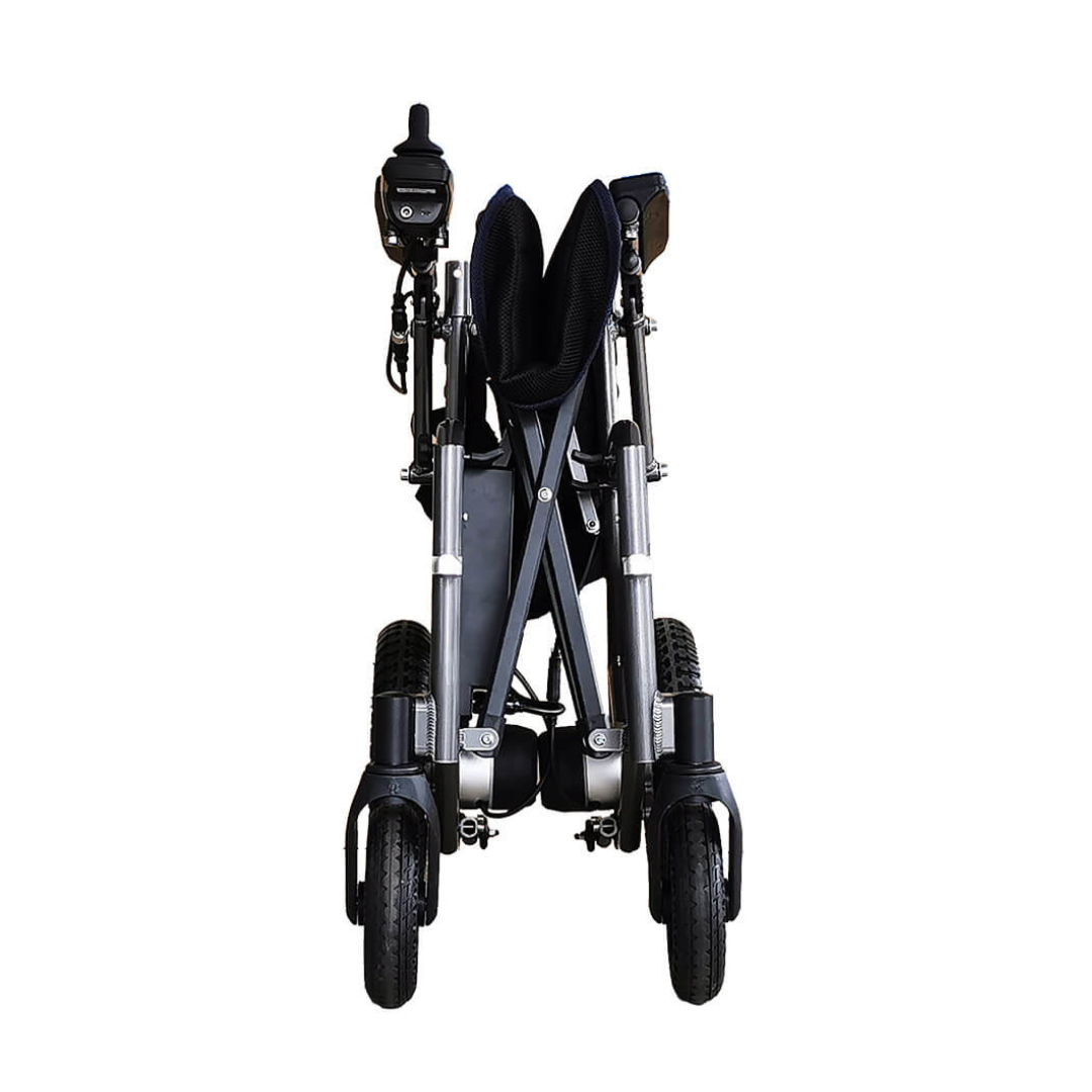 The Foldawheel ECO Lightweight Folding Powerchair is shown from the front, folded compactly with black and silver components and two large front wheels visible.