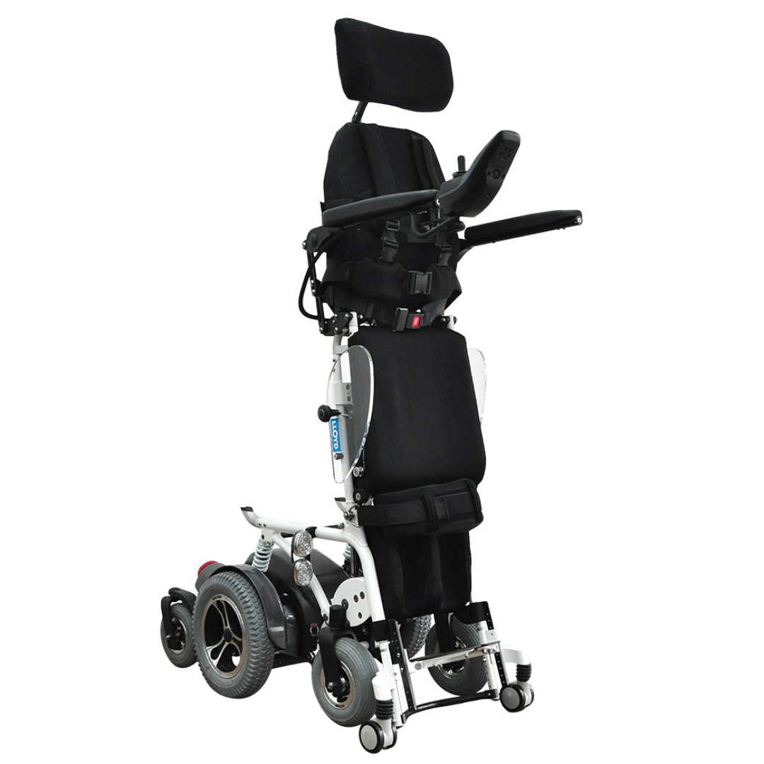 The Foldawheel Lloyd Draco Advanced Standing Power Wheelchair is a black and white electric chair with padded seat, headrest, armrests, footrests, multiple wheels, and a standing frame. Shown upright in a standing position.