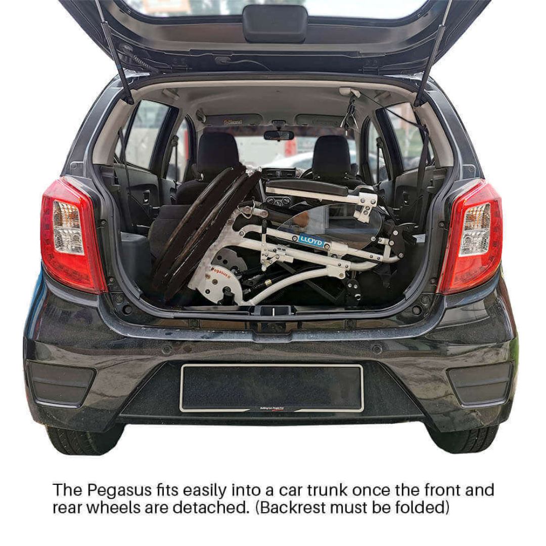 A Foldawheel Lloyd Pegasus Semi-Powered Standing Wheelchair, folded with its wheels detached, fits easily in the open trunk of a small black car when the backrest is folded and wheels are removed.
