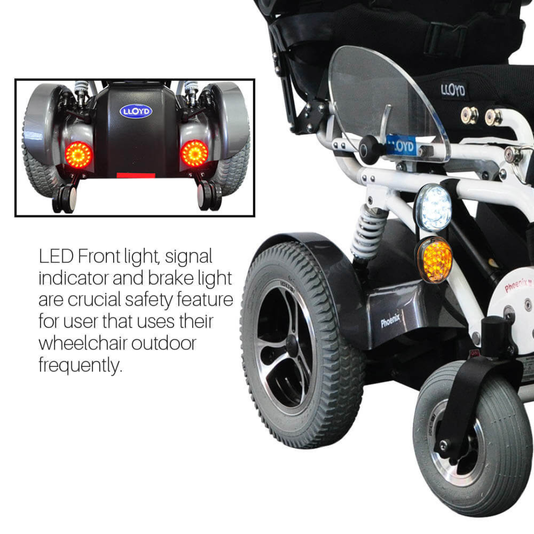 Close-up of the Foldawheel Lloyd Phoenix 2 Standing Power Wheelchair highlights its LED front light, signal indicator, brake light, and rear lights—essential advanced features for safer outdoor mobility.