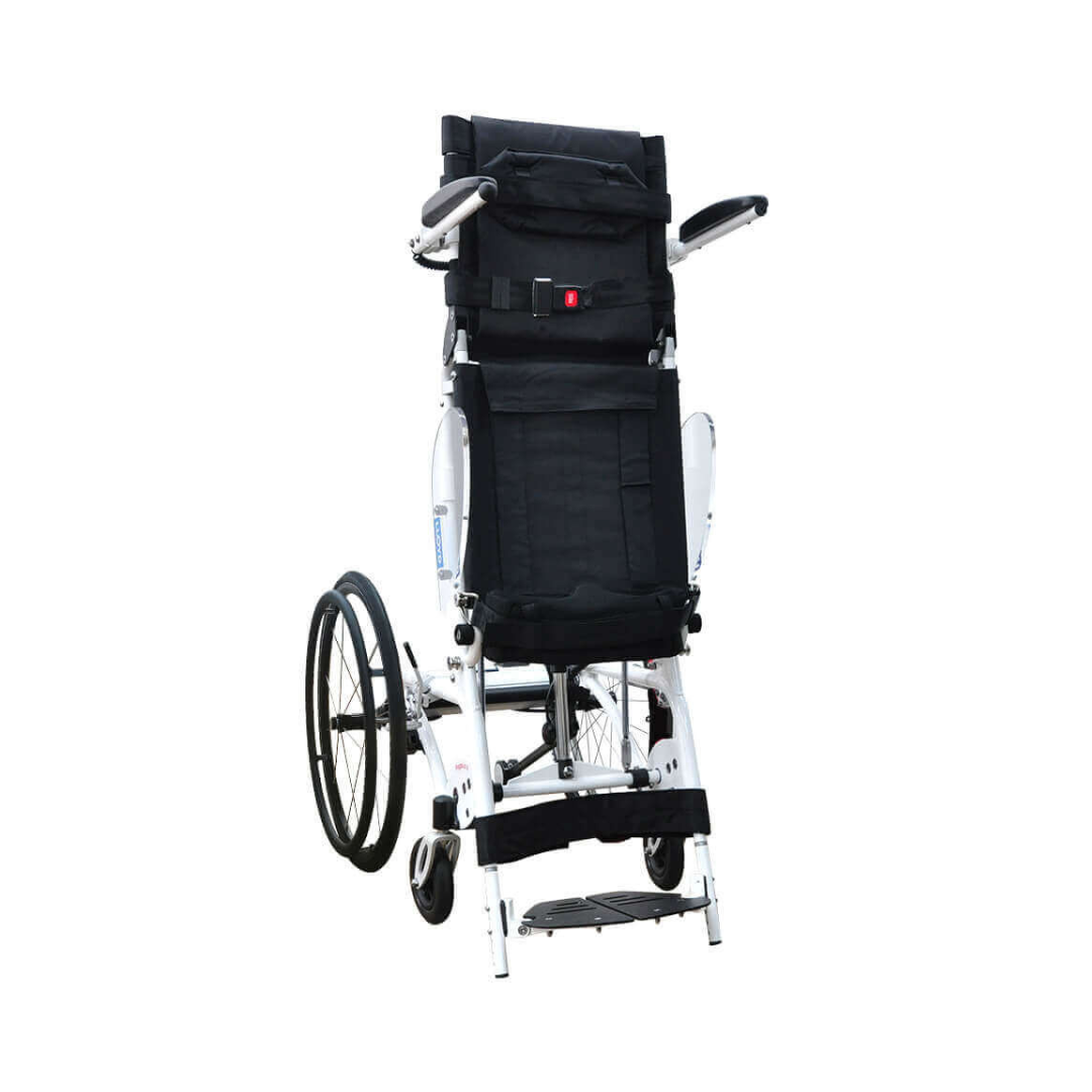 The Foldawheel Lloyd Pegasus Semi-Powered Standing Wheelchair in black and white stands upright on its rear wheels, featuring padded armrests, a safety belt, and adjustable footrests—ideal for users with limited strength, shown on a plain white background.