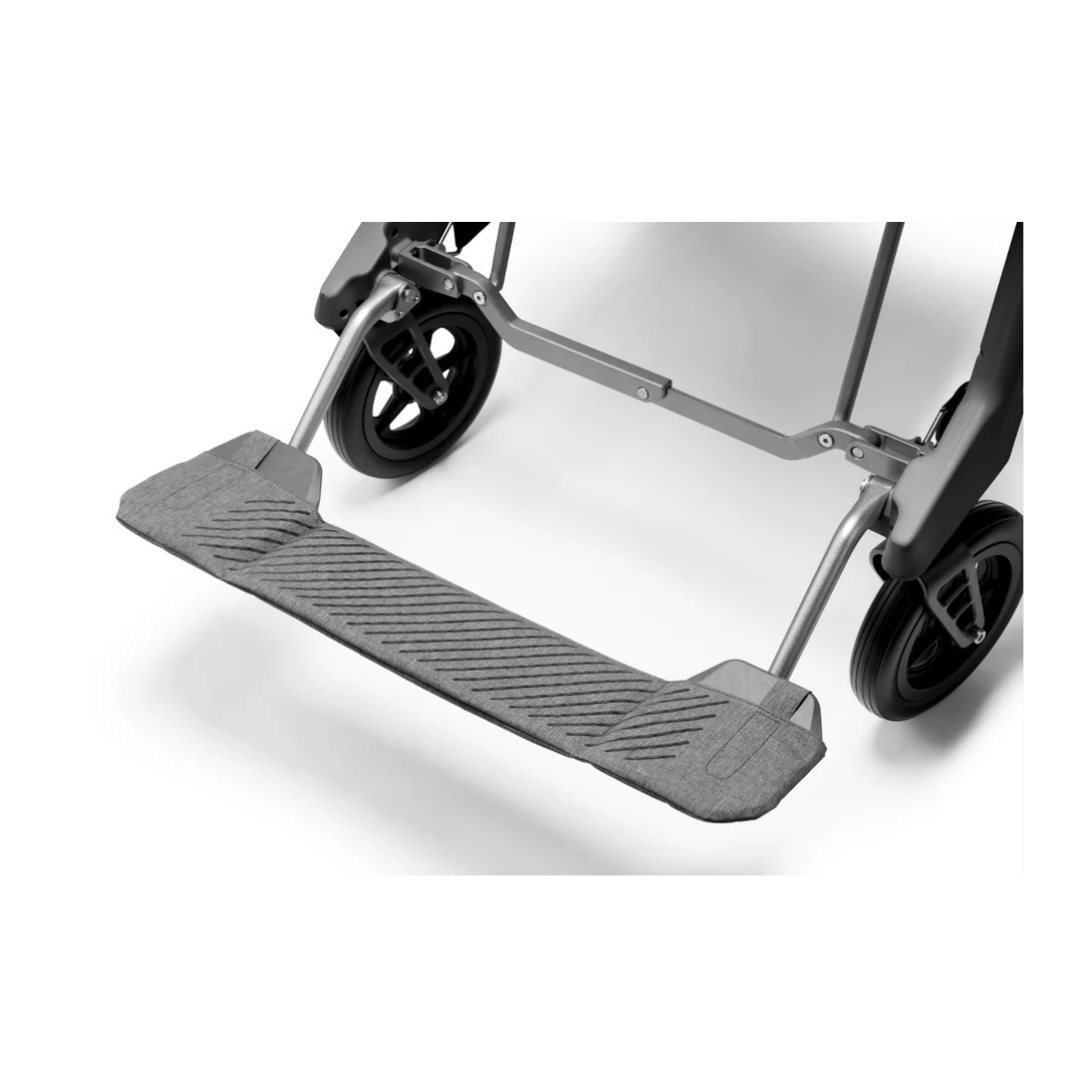Close-up view of the Footrest Center Support Panel for Roamate Wheelchair, showing its textured anti-slip surface and sturdy metal frame with two rear wheels visible.