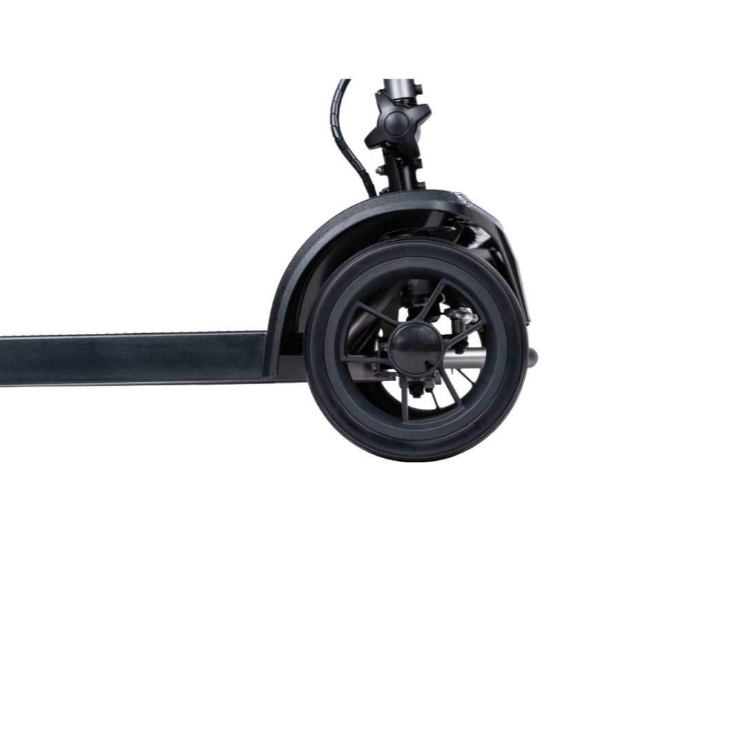 Close-up of the rear wheel and fender of a Forcemech PathMate Portable Mobility Scooter in black, highlighting its spoke design, part of the deck, and portable construction against a white background.