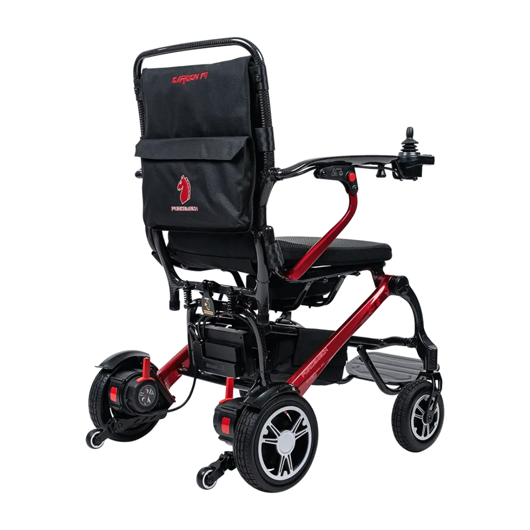 The Forcemech Carbon F1 Ultralight Folding Powerchair weighs just 33 lbs, features a red frame, black seat, joystick controller, rear storage pouch, and compact rear wheels—ideal as a travel wheelchair for on-the-go mobility.