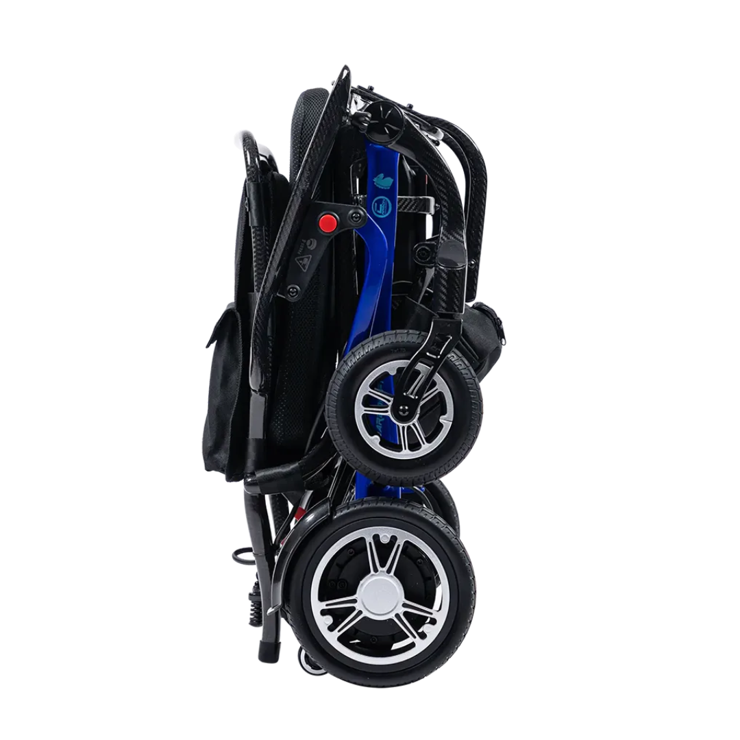 The Forcemech Carbon F1 Ultralight Folding Powerchair (only 33 lbs) features a compact, foldable design with a black seat and frame, blue side accents, and silver-rimmed wheels—upright for easy storage or transport.