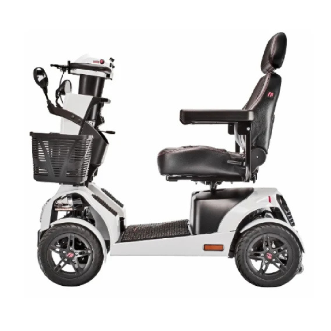 Side view of the FreeRider FR1 Terrain Heavy Duty Mobility Scooter in white with a black cushioned seat, headrest, armrests, front basket, and four large wheels. Inspired by SuperSport car design for superior personal mobility and handling.