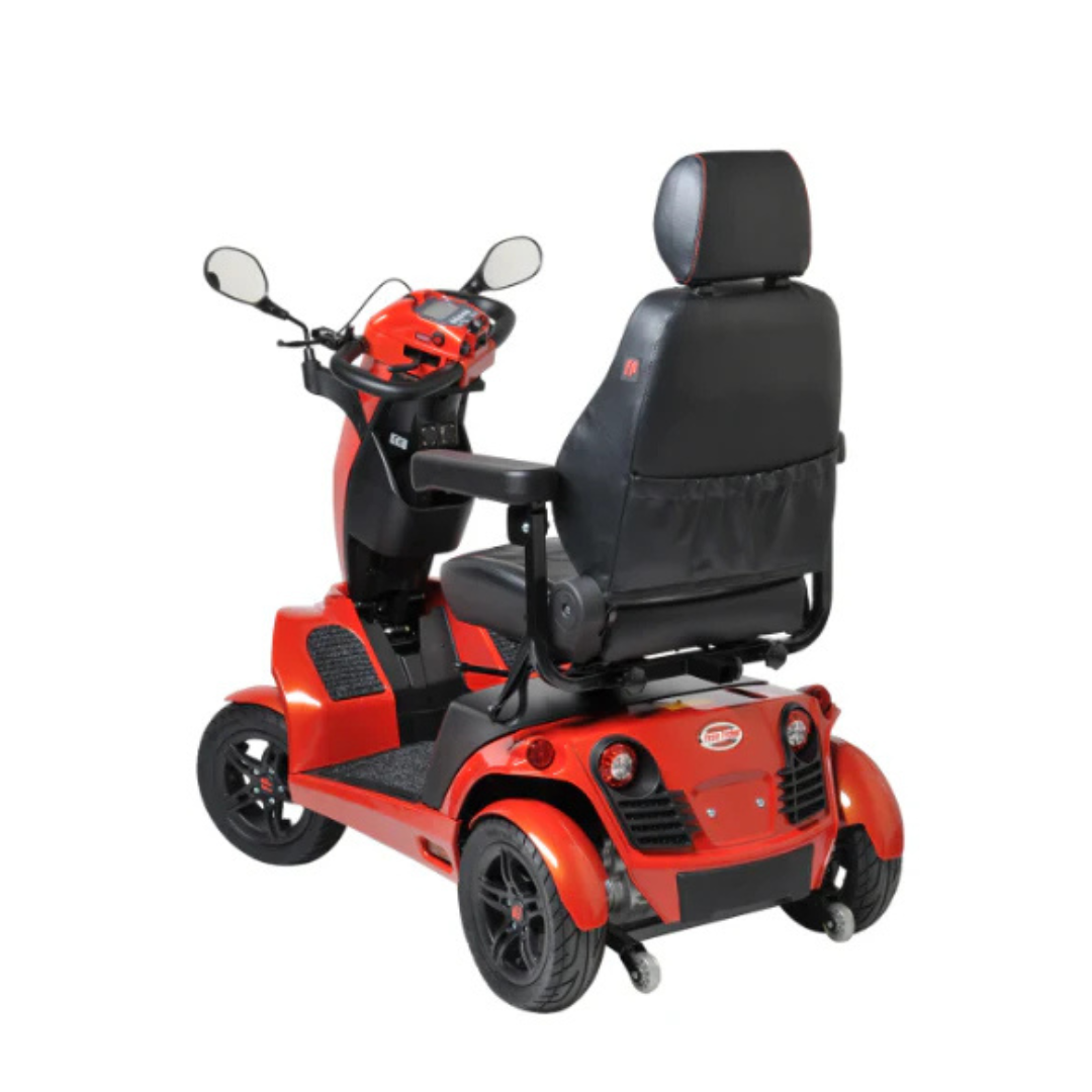 The FreeRider FR1 Terrain Heavy Duty Mobility Scooter, in red, features four wheels, a high-backed seat, rearview mirrors, black armrests, and a control panel. Sporty and agile, it’s shown from the back left on a white background.