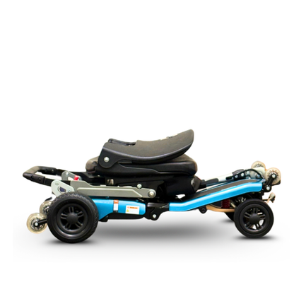 The FreeRider Luggie Super Plus 4 Travel Scooter is shown compactly folded, highlighting its wheels and seat against a white background—ideal for convenient mobility and everyday travel.
