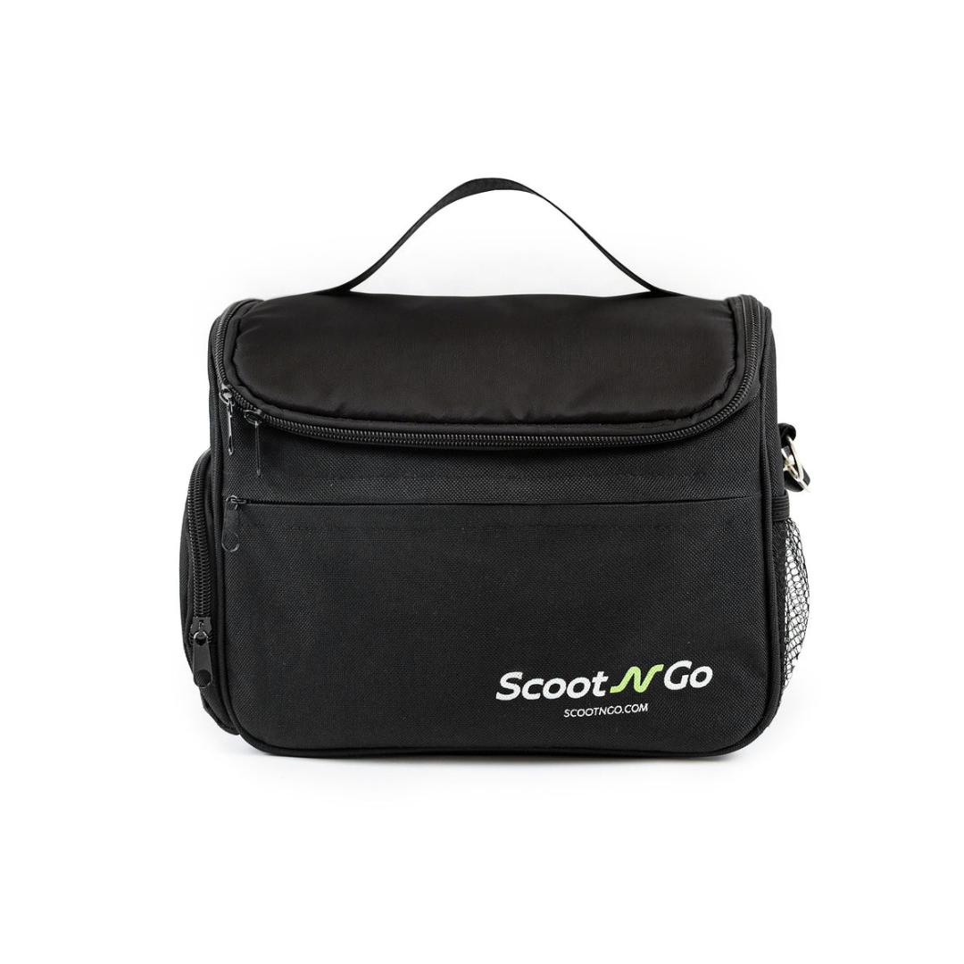 A Front Basket Bag/Battery Bag for ScootNgo Lite/Voyager, crafted from durable Oxford cloth and featuring a sleek black design. This mobility scooter accessory includes a top handle, front zipper pocket, side mesh pocket, and a distinctive white and green logo on the front. The stylish bag sits upright against a white background.