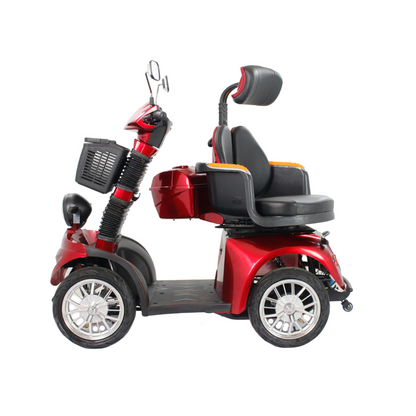 The GIO Tron Pro, a red 4-wheel mobility scooter with smart seat technology, features a black seat, headrest, armrests, footrest platform, front basket, and rearview mirrors. It is shown in profile on a white background.