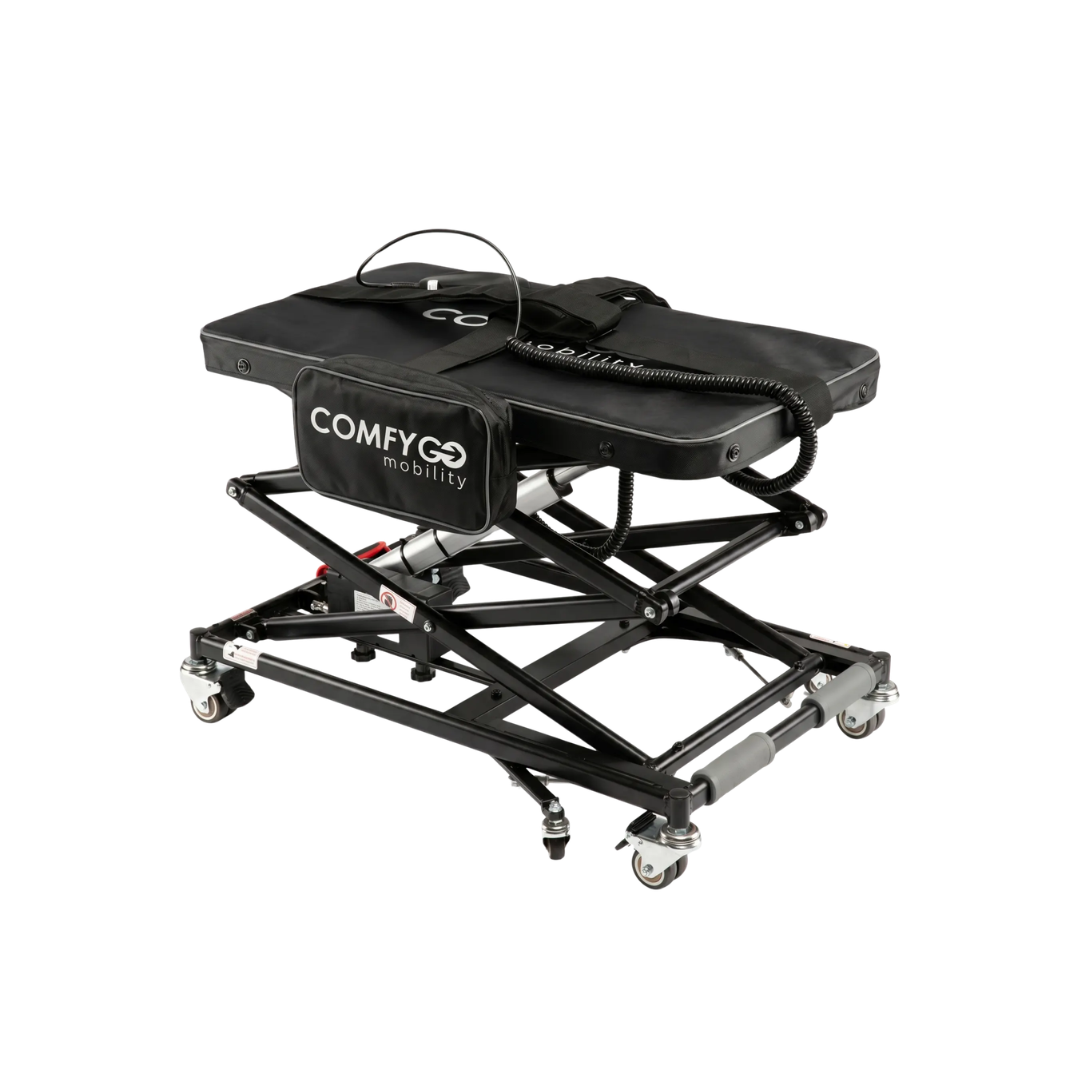 A ComfyGo GO-Lift Portable Lift for Electric Wheelchairs and Scooters, featuring a sturdy metal frame, caster wheels, padded top, handle, and storage pouch in black—perfectly designed for effortless transport and convenience when moving your mobility device.