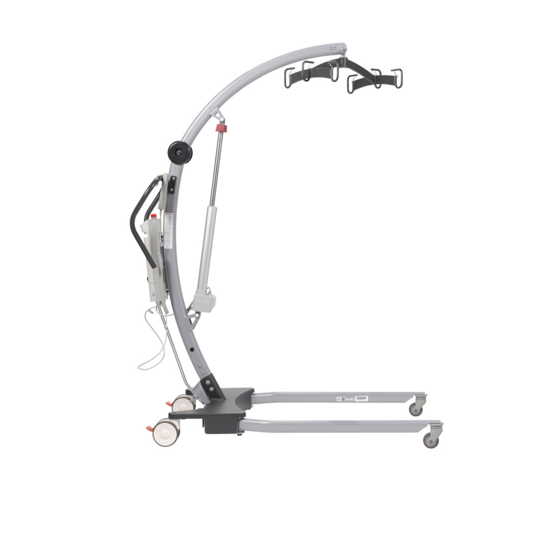A side view of a caregiver-friendly Drive Gravis Battery-Powered Patient Floor Lift with wheels, a curved metal frame, battery-powered lifting, and black handles for safe transfer of individuals with limited mobility.