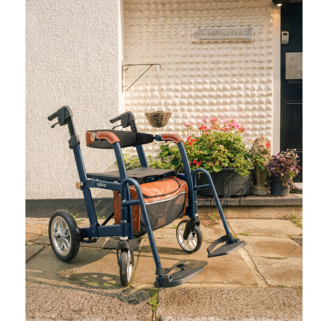 Navy blue uplivin Gavo 2-in-1 Hybrid Rollator & Wheelchair with a brown seat and storage bag, positioned on a patio.