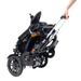 A person pulls the compact, folded Glide Care G-5 Lightweight Foldable Electric Wheelchair by its extended handle, highlighting its easy portability and travel-friendly design.