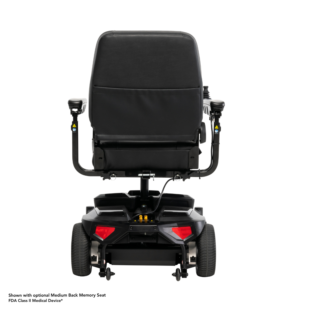 A rear view of the Pride Mobility Go Chair® MED Portable Powerchair in black with a medium backrest, armrests, and joystick is shown on a white background. Optional seat noted; FDA classified device.