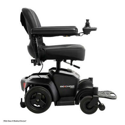 Side view of the Pride Mobility Go Chair® MED Portable Powerchair, featuring a padded seat, armrests, footrest, right-arm joystick controller, and four wheels—lightweight and portable, ideal for travel. Branding visible on the side.