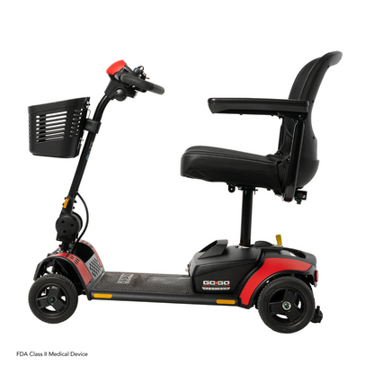 The Pride Mobility Go Go Elite Traveller® 2 Platinum Scooter is a three-wheeled travel scooter with red and black accents, black seat with armrests, and a front basket, shown side view against a white background.