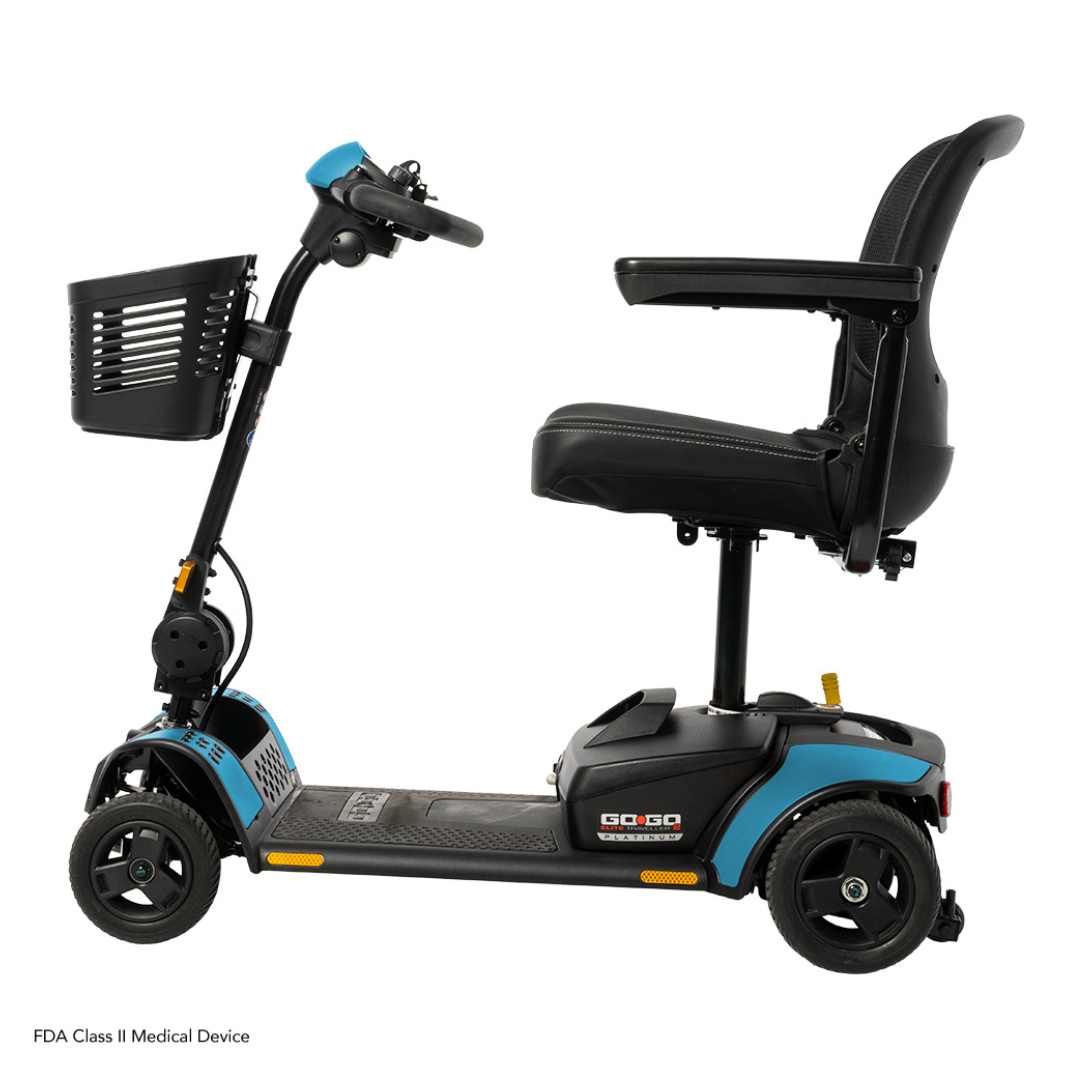 A side view of the Pride Mobility Go Go Elite Traveller® 2 Platinum Scooter, a blue and black three-wheel travel scooter with a front basket, padded seat with backrest and armrests, labeled GO-GO, designed for personal transportation.