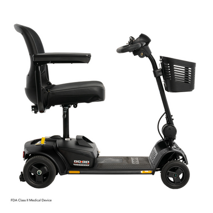 The Pride Mobility Go Go Elite Traveller® 2 Platinum Scooter is a sleek black travel scooter with EZ Turn technology, padded seat, armrests, handlebars, control panel, and front basket—compact and designed for personal mobility.