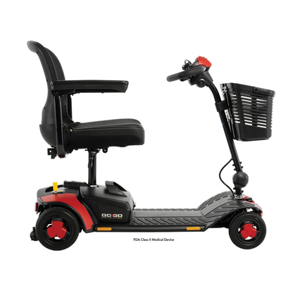 A black, four-wheeled Pride Go Go® Elite Traveller Gen 3 Scooter with a red-accented base, front storage basket, and adjustable seat.