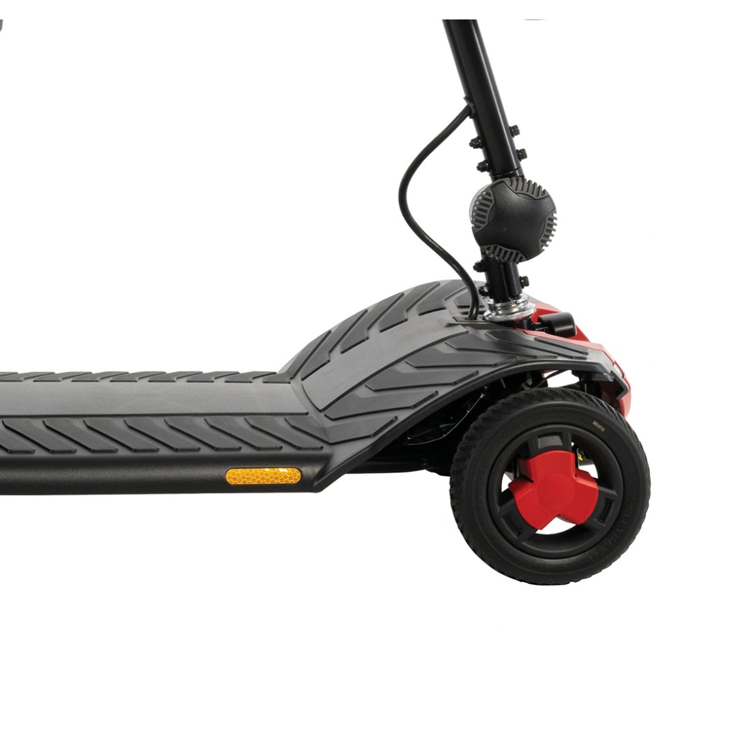 Close-up view of the front wheel and deck of a Pride Go Go® Elite Traveller Gen 3 Scooter, featuring a red and black wheel hub.