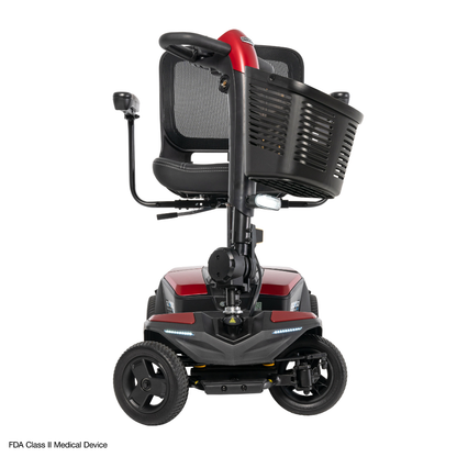 The Pride Mobility Go Go® Endurance AL+ Power Scooter, in red and black with a mesh seat, large front basket, three wheels, and LED lights, is displayed on a white background—perfect for responsive layouts using the Inter font.