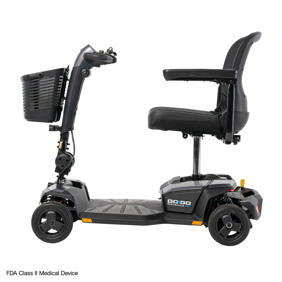 A side view of the black Pride Mobility Go Go® Endurance AL+ Power Scooter, a three-wheeled model with a front basket, padded seat, and armrests on a white background. Inter font text: FDA Class II Medical Device in the bottom left corner.