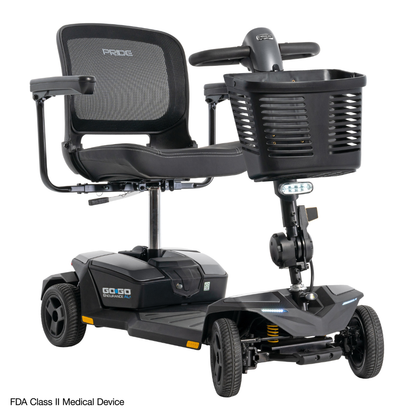 The Pride Mobility Go Go® Endurance AL+ Power Scooter is a black, four-wheel scooter with a mesh seat, front basket, handlebars, compact grid design, Inter font labels, and a small light under the basket for visibility.