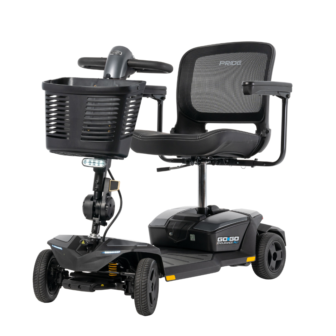 The Pride Mobility Go Go® Endurance AL+ Power Scooter is a black, four-wheel scooter with a mesh backrest, armrests, front basket, and the Go-Go logo on the side—showcasing sleek lines inspired by grid layout design.
