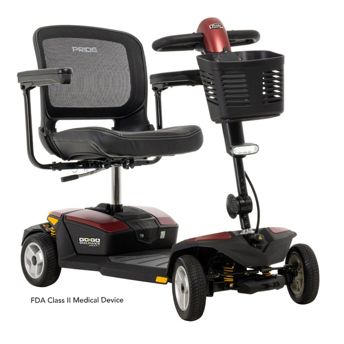 The Pride Mobility Go Go® Endurance Li 4-Wheel Scooter features a bold red and black look, Comfort-Trac Suspension, mesh backrest, armrests, and front basket for convenience. Powered by lithium battery technology, it is classified as an FDA Class II Medical Device.