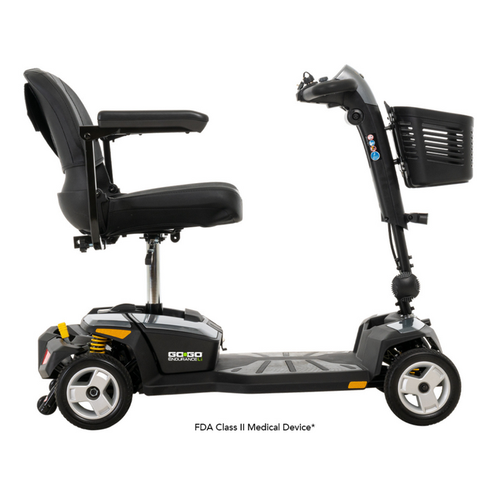Side view of the sleek black Pride Mobility Go Go® Endurance Li 4-Wheel Scooter with a lithium battery, padded seat and armrests, handlebars, and front basket. Its sturdy frame with Comfort-Trac Suspension ensures accessibility and unparalleled comfort.