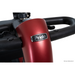 A close-up of the handlebars on a red Pride Mobility Go Go® Endurance Li 4-Wheel Scooter shows steering controls with a metallic finish and the Pride logo. FDA Class II Medical Device is displayed in the lower right corner. Comfort-Trac Suspension ensures an exceptionally smooth ride.