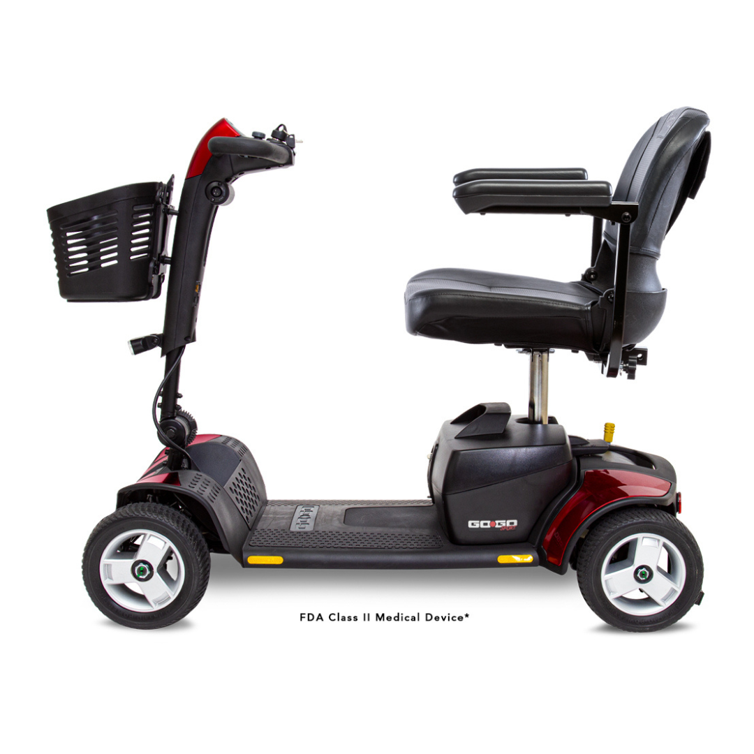 Side view of the Pride Go Go® Sport 4-Wheel Scooter in red and black with front basket, padded seat, armrests, and four wheels on a white background.